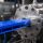 Close up view of plastic extrusion die shaping molten material